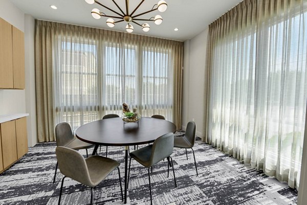 Meeting room with modern tech at Stadia Med Main Apartments in Med Main, offering a premium space for presentations and conferences