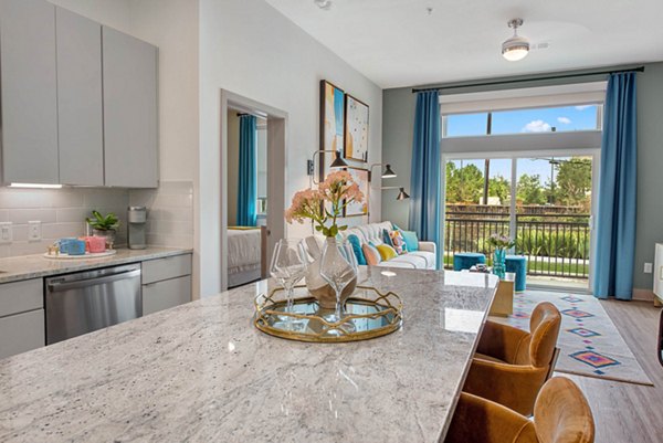 Contemporary kitchen with stainless steel appliances in Stadia Med Main Apartments