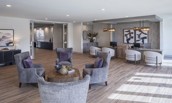 Modern clubhouse featuring vibrant seating and pool table at Prose KTX Apartments, ideal for social gatherings and relaxation