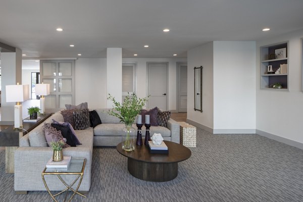 Contemporary clubhouse with cozy seating at Prose KTX Apartments