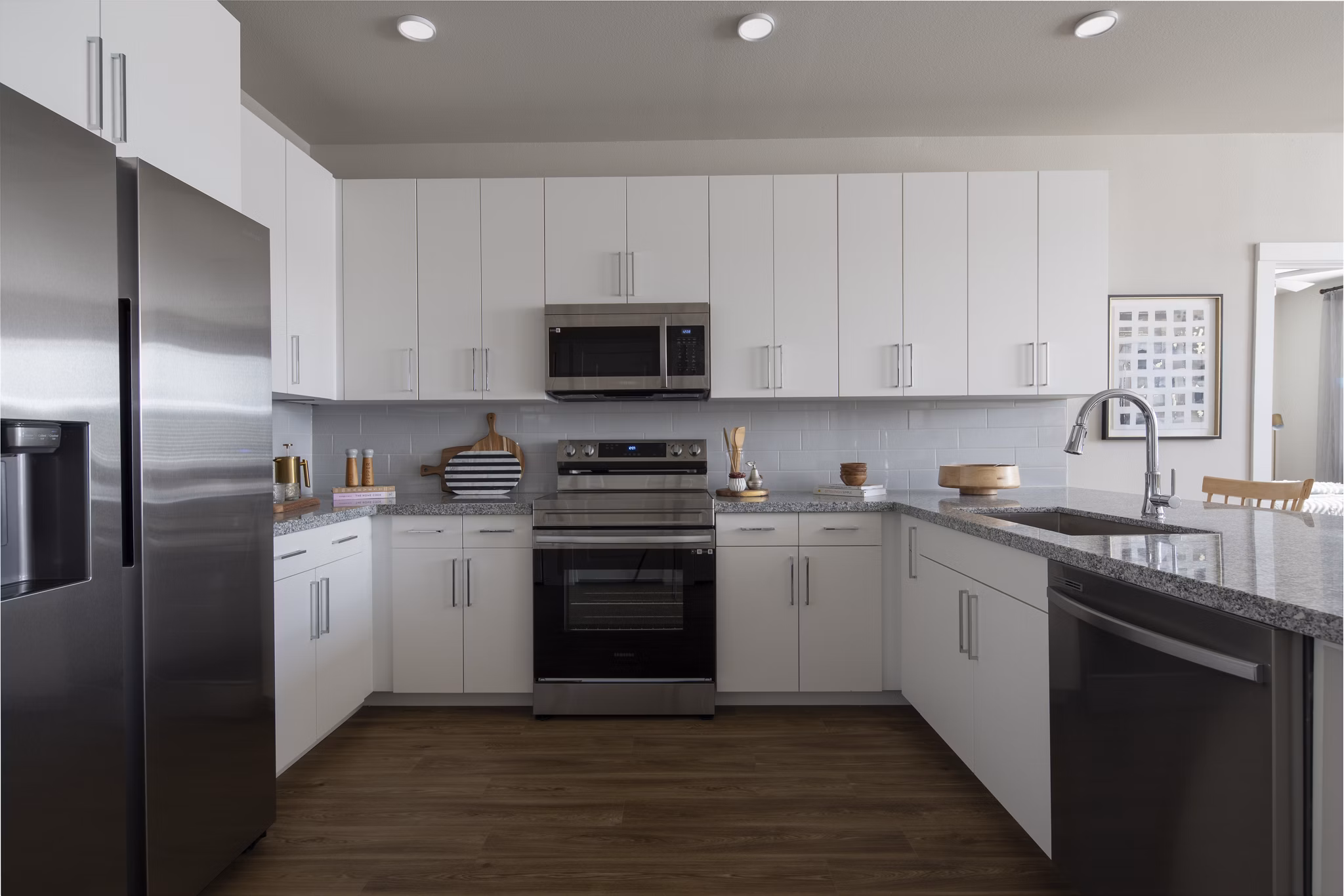 Modern kitchen with stainless steel appliances at Prose KTX Apartments