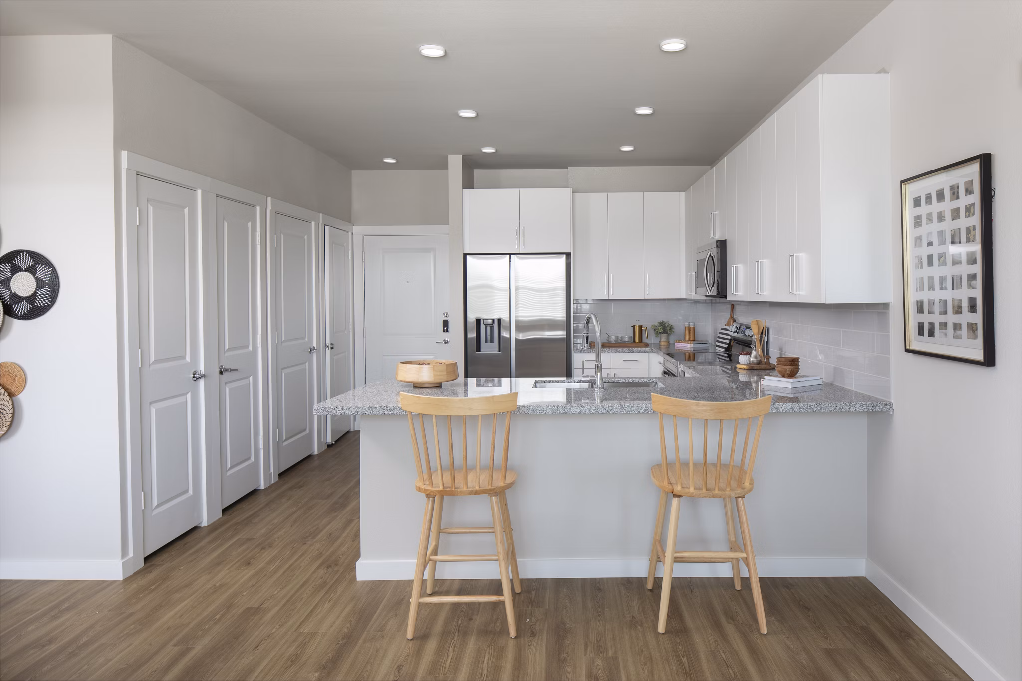 Modern kitchen with stainless steel appliances at Prose KTX Apartments, luxury living by Greystar