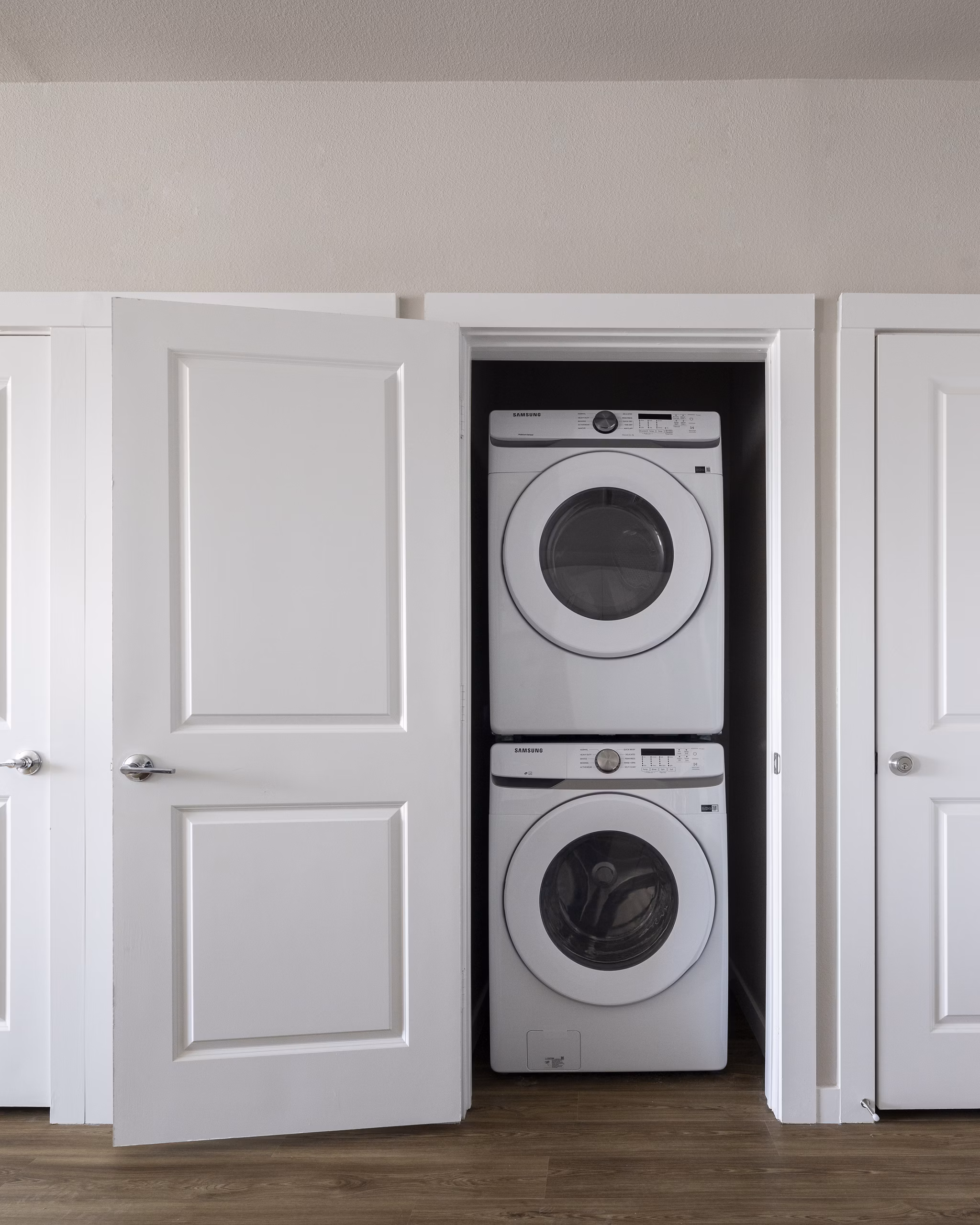 Laundry room with high-efficiency washers and dryers at Prose KTX Apartments