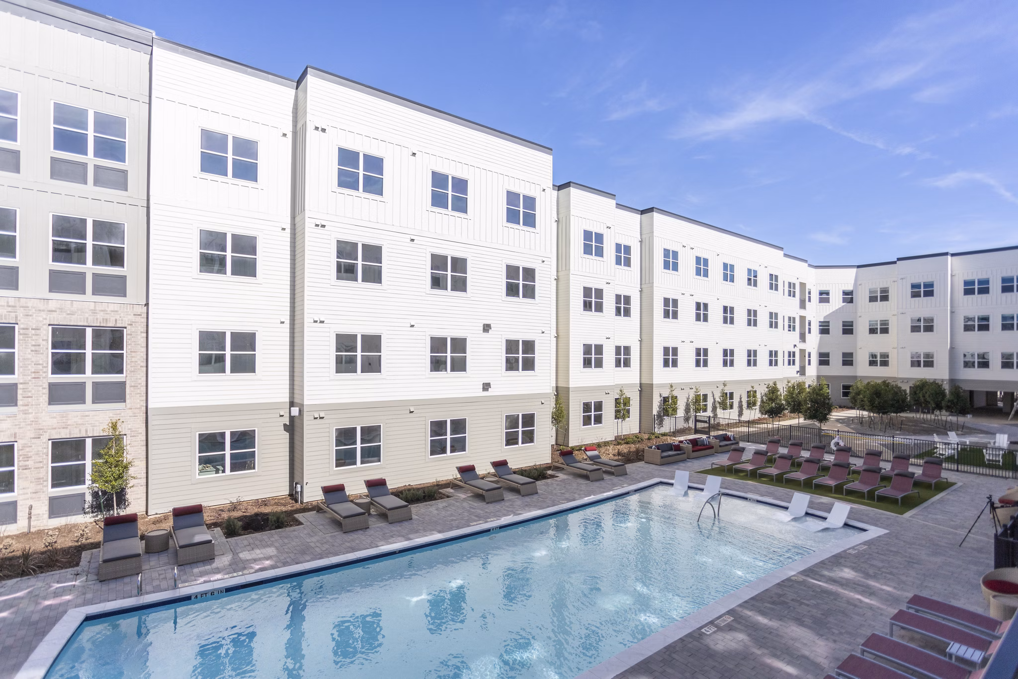 Resort-style pool at Prose KTX Apartments with ample lounging area and modern design