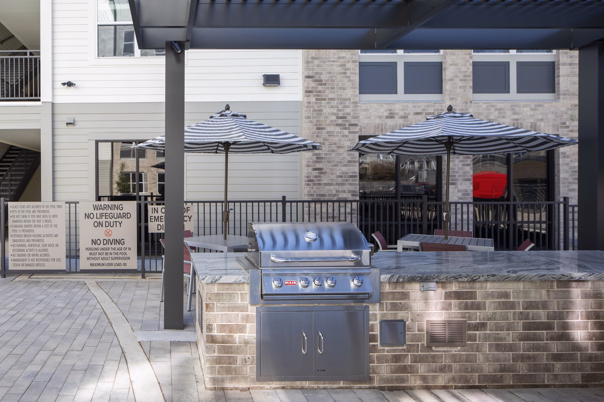 Modern outdoor patio with seating at Prose KTX Apartments
