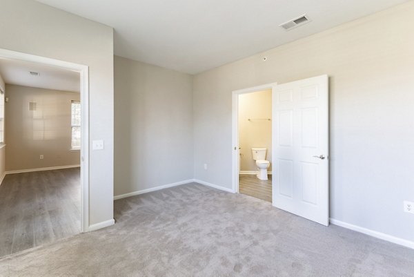 Cozy bedroom with neutral decor at Nav850 Apartments