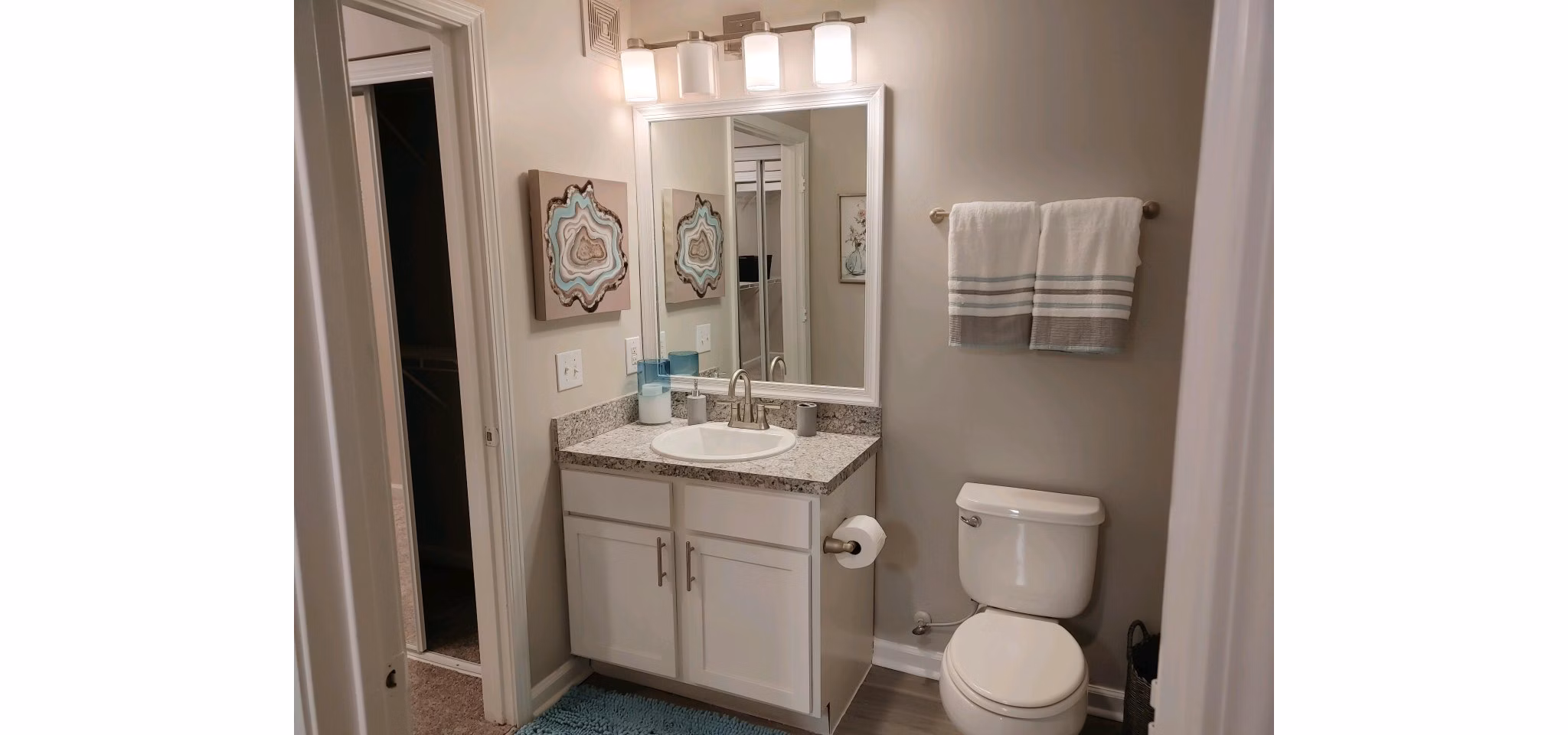 Modern bathroom with sleek fixtures at Nav850 Apartments, a luxury Greystar community