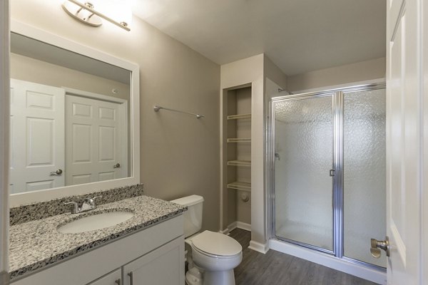 Bathroom with sleek design and modern fixtures at Nav850 Apartments