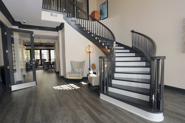 Clubhouse with modern furnishings and open layout at Nav850 Apartments