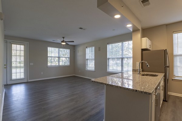 Modern kitchen with stainless steel appliances in Nav850 Apartments