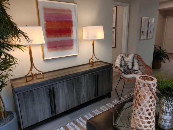 Spacious living room with modern decor in Nav850 Apartments, showcasing comfort and style for luxury living