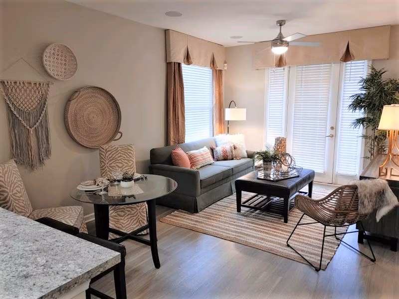 Bright living room with modern furnishings at Nav850 Apartments