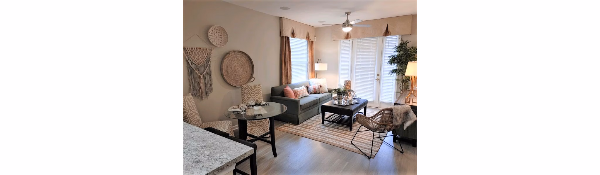 Bright living room with modern furnishings at Nav850 Apartments