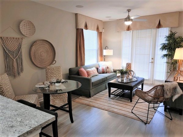 Bright living room with modern furnishings at Nav850 Apartments