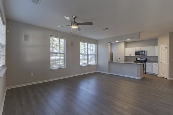 Spacious living room with modern decor at Nav850 Apartments
