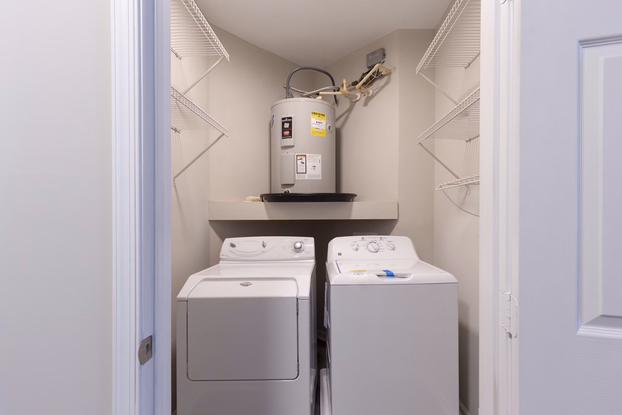 Modern laundry room with energy-efficient machines at Nav850 Apartments