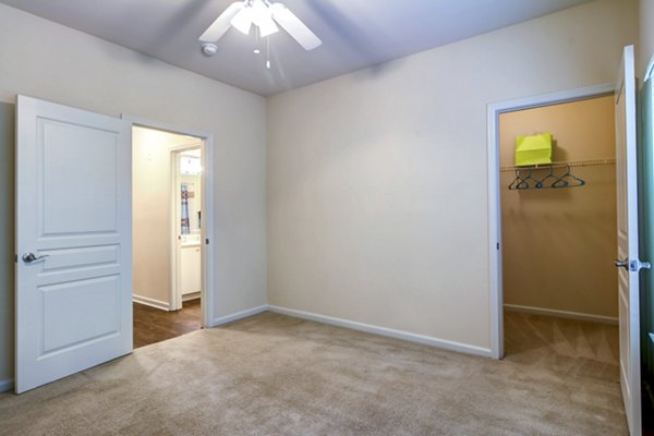 Modern bedroom with sleek furnishings in Aventura Decatur Apartments