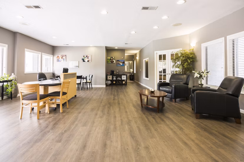 Elegant clubhouse with lounge seating at Aventura Dunwoody Apartments, ideal for social gatherings and relaxation