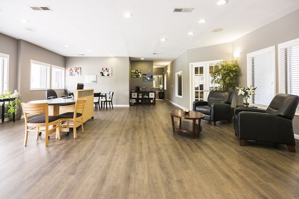 Elegant clubhouse with lounge seating at Aventura Dunwoody Apartments, ideal for social gatherings and relaxation
