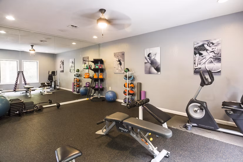 State-of-the-art fitness center at Aventura Dunwoody Apartments with modern equipment and spacious workout areas for all residents