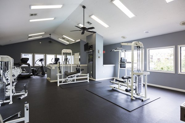 State-of-the-art fitness center at Aventura Dunwoody Apartments with modern workout equipment and spacious design