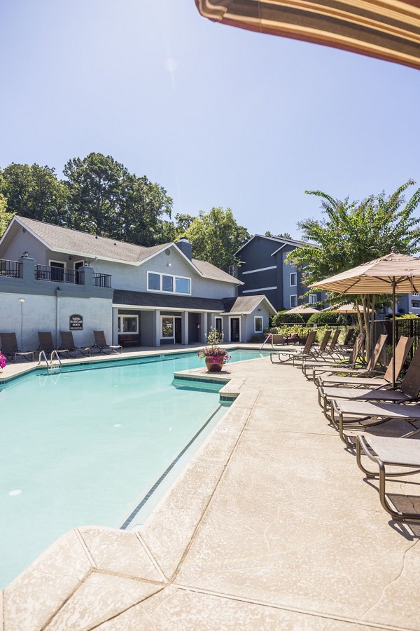 Resort-style pool with lounge chairs at Aventura Dunwoody Apartments