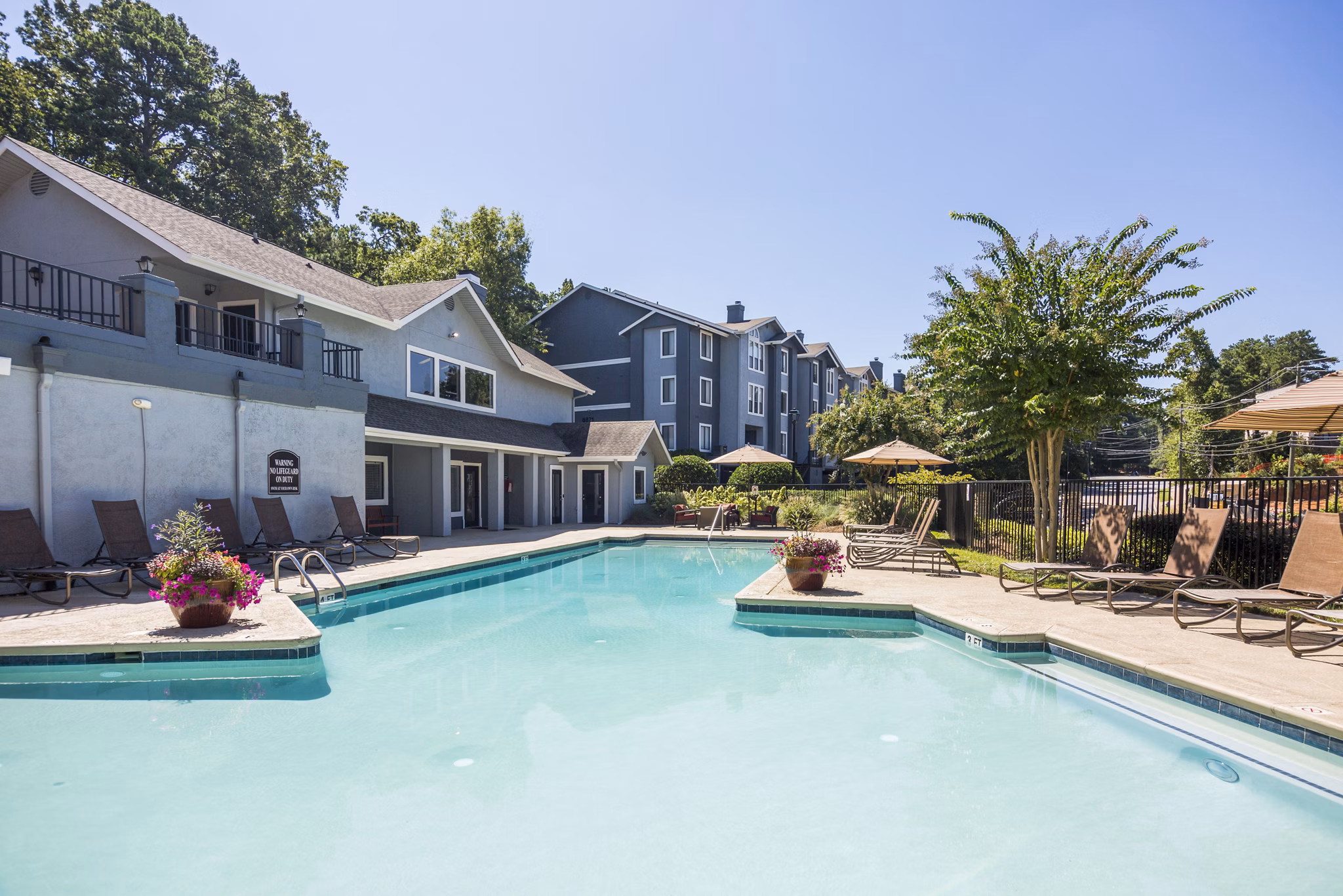 Rooftop pool with city view at Aventura Dunwoody Apartments