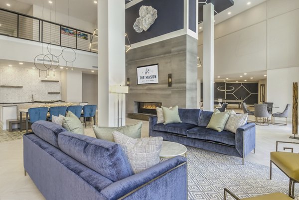 The Mason at Six Mile Creek Apartments: Modern clubhouse interior with stylish seating areas and large windows