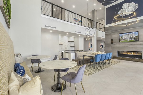 Clubhouse with modern design and cozy seating at The Mason at Six Mile Creek Apartments, offering luxury amenities and community spaces