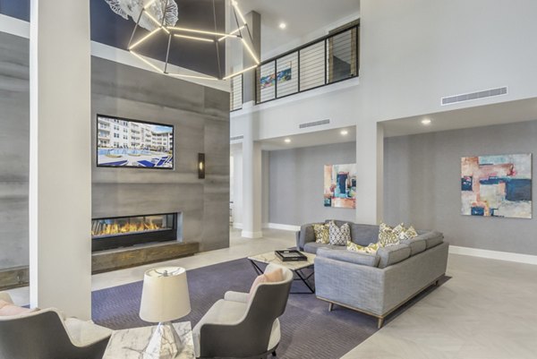 Clubhouse with modern design at The Mason at Six Mile Creek Apartments, offering luxury amenities and comfortable gathering spaces