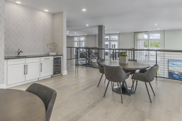 Elegant clubhouse with modern design at The Mason at Six Mile Creek Apartments, ideal for gatherings and relaxation in a luxury setting
