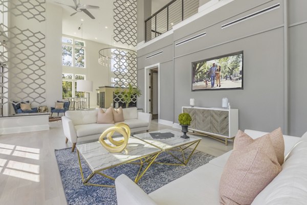 Elegant clubhouse with stylish seating and decor at The Mason at Six Mile Creek Apartments