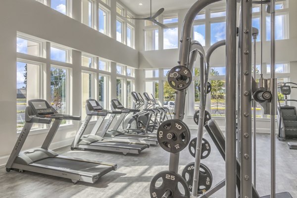 Modern fitness center with state-of-the-art equipment at The Mason at Six Mile Creek Apartments