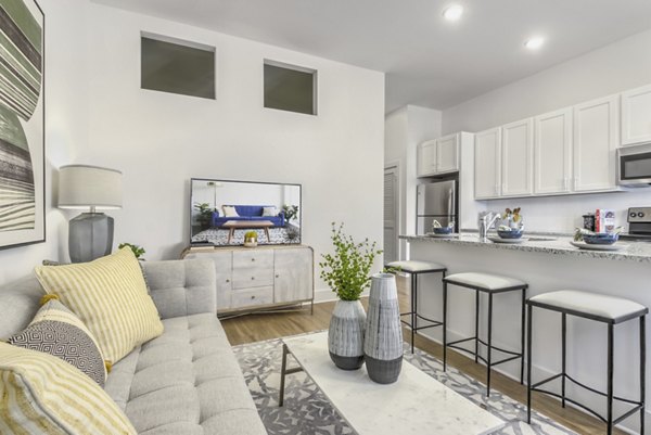 Spacious living room with modern decor in The Mason at Six Mile Creek Apartments