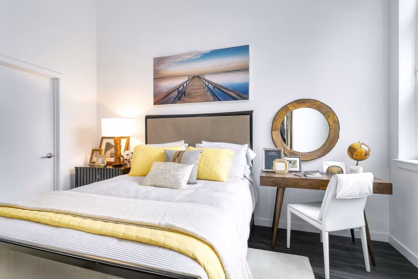 Bedroom featuring modern furnishings at Harbor Landing Apartments in Greystar luxury community