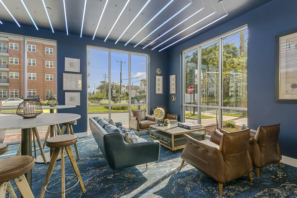 Clubhouse featuring modern design and ample seating at Harbor Landing Apartments