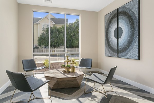 Clubhouse with modern decor and seating at Harbor Landing Apartments