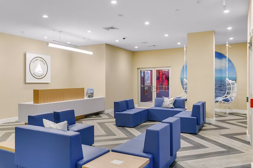 Clubhouse featuring modern design and seating area at Harbor Landing Apartments