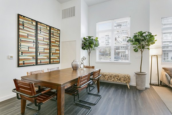 Dining area with modern decor and natural light at Harbor Landing Apartments