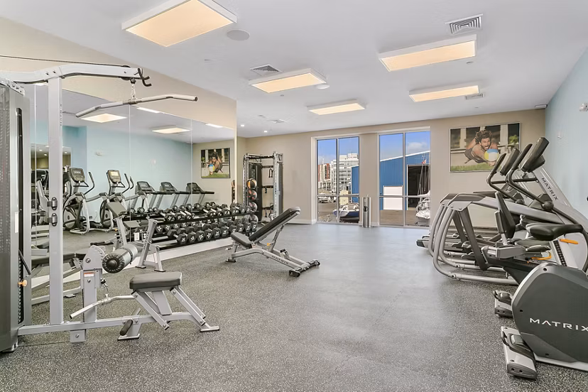 Modern fitness center with state-of-the-art equipment at Harbor Landing Apartments