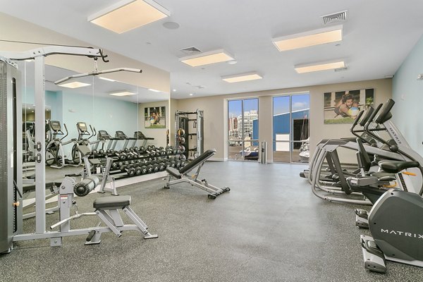 Modern fitness center with state-of-the-art equipment at Harbor Landing Apartments