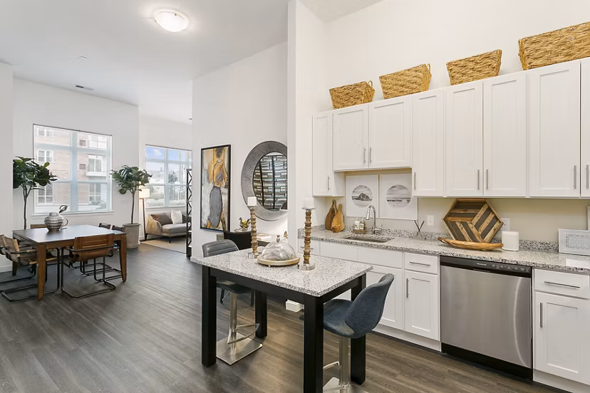 Modern kitchen with stainless steel appliances at Harbor Landing Apartments Stylish design enhances luxury living experience