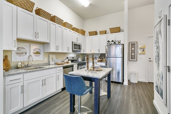 Modern kitchen with stainless steel appliances at Harbor Landing Apartments