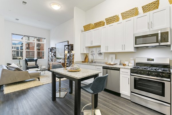 Harbor Landing Apartments: Modern kitchen with stainless steel appliances and granite countertops