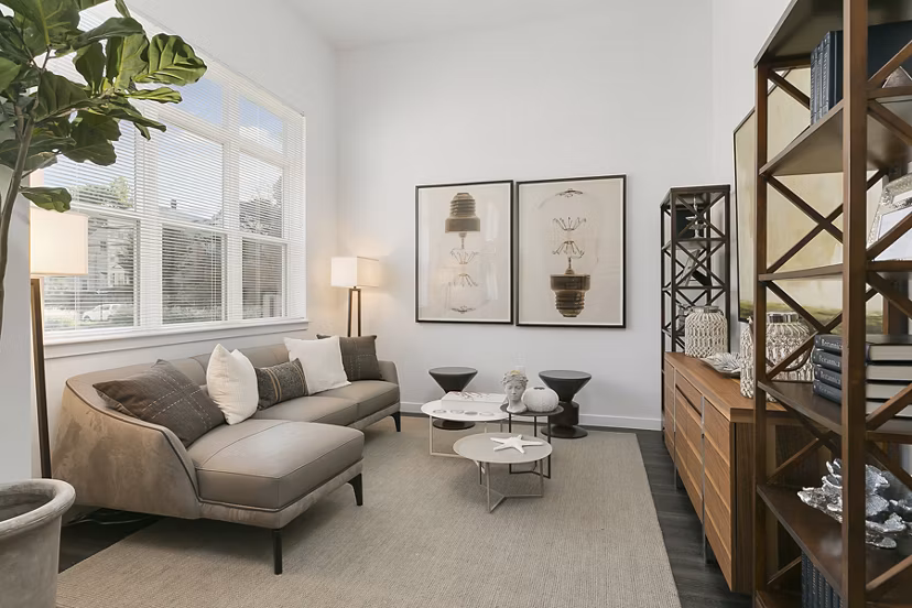 Living room with contemporary decor and open floor plan at Harbor Landing Apartments