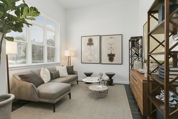 Living room with contemporary decor and open floor plan at Harbor Landing Apartments