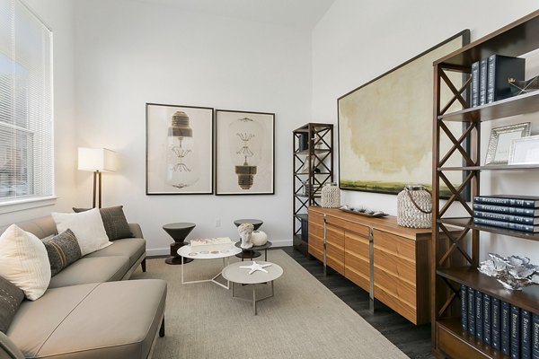 Spacious living room with modern furnishings at Harbor Landing Apartments, offering luxury living and design