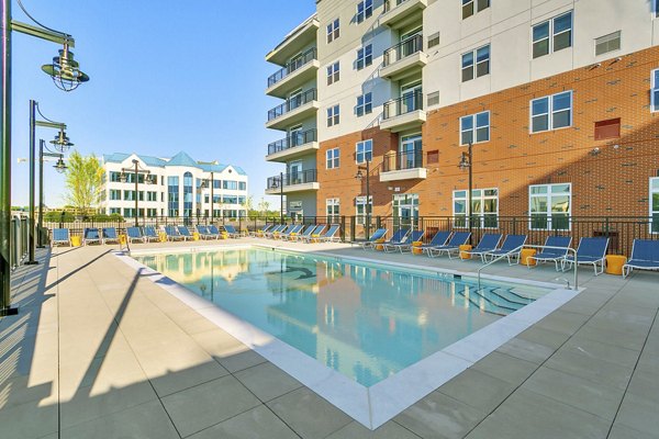 Elegant outdoor pool area at Harbor Landing Apartments offering luxury waterfront living experience