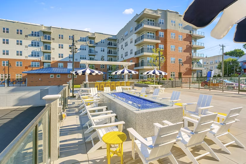 Cozy outdoor fire pit at Harbor Landing Apartments, a Greystar luxury community with stunning marina views
