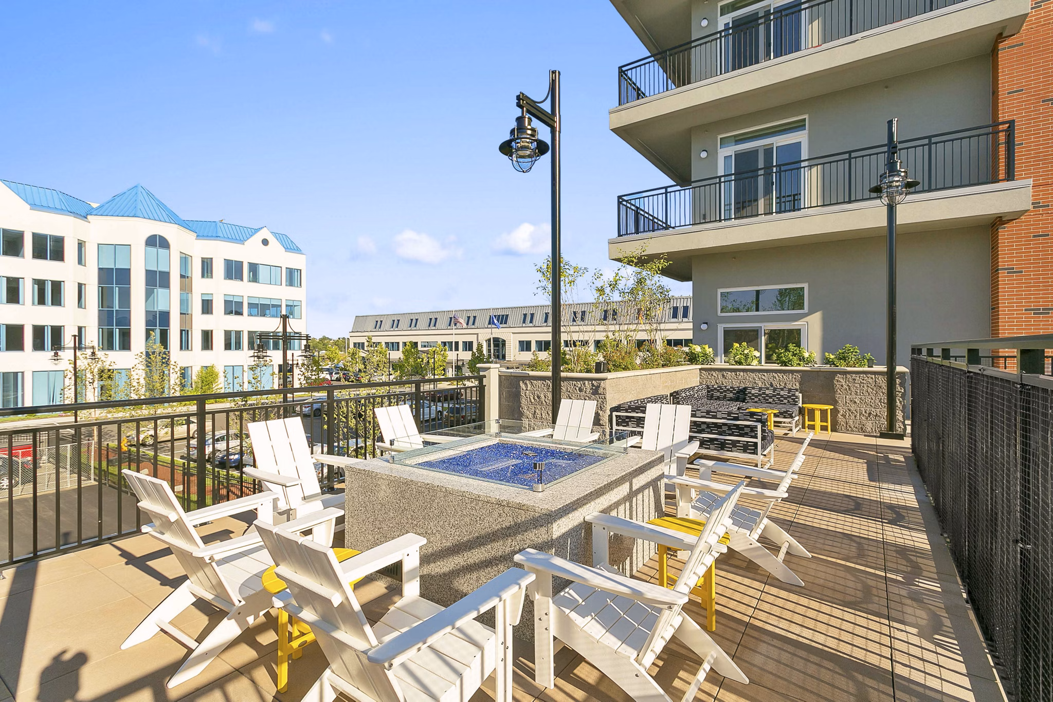 Cozy fire pit area at Harbor Landing Apartments, inviting outdoor gathering space perfect for relaxation and socializing